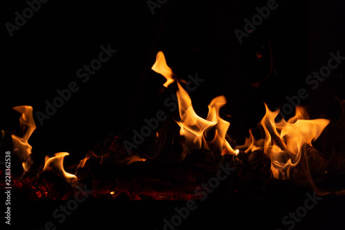 Flame of fire on a black background © donikz