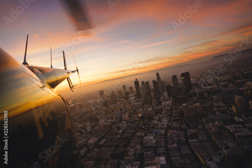 View of the city at sunset from a helicopter