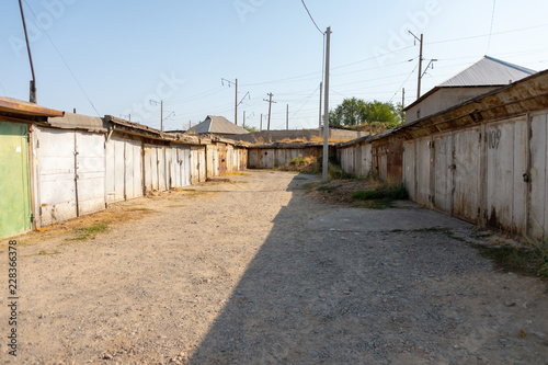 a row of old car garages built in the last century © donikz
