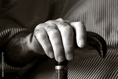 Billede på lærred old caucasian man with a walking stick.