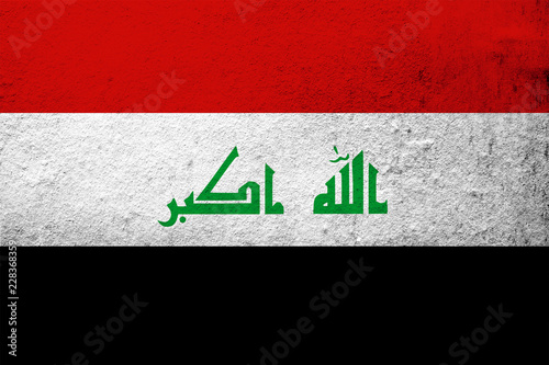 the Republic of Iraq National flag. Grunge background