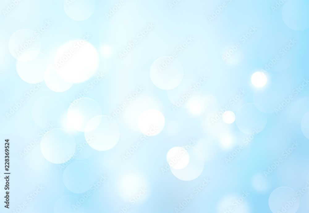Light blue blurred abstract bokeh background.