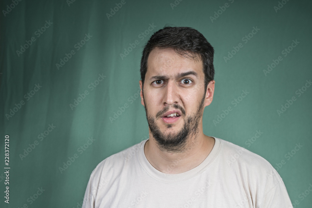 man with a face of disbelief, raising his eyebrow man with a face of disbelief, raising his eyebrow