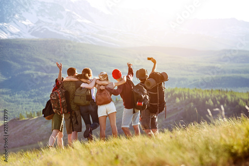 Happy tourists friends making selfie in mountains area