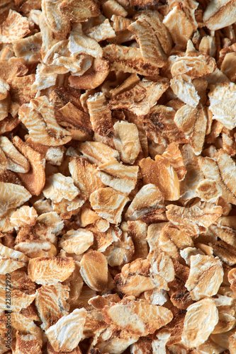 Uncooked oat flakes as a background. Close up, top view, high resolution product. Healthy food Concept.