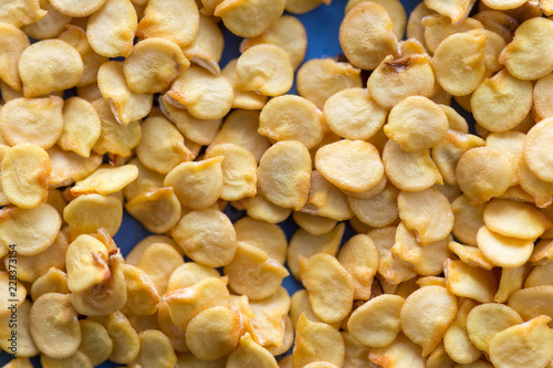 bitter pepper seeds on a blue background macro