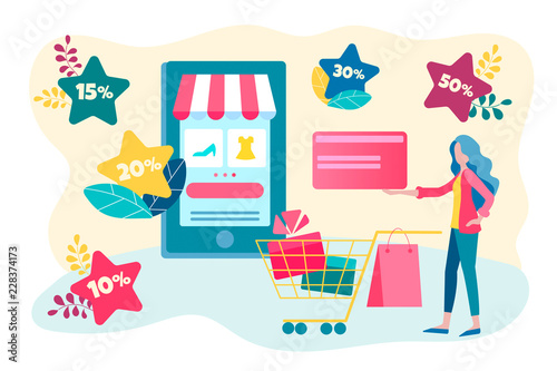 Young woman pays for credit card purchases in the online store