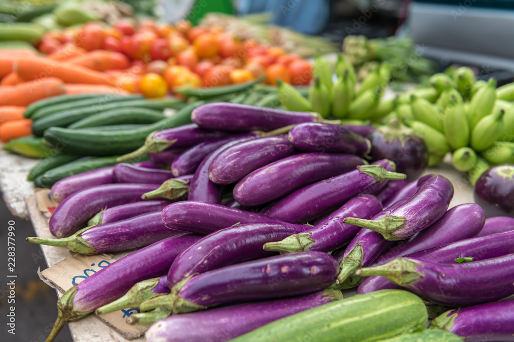 Eggplants and other vegetables on a market.