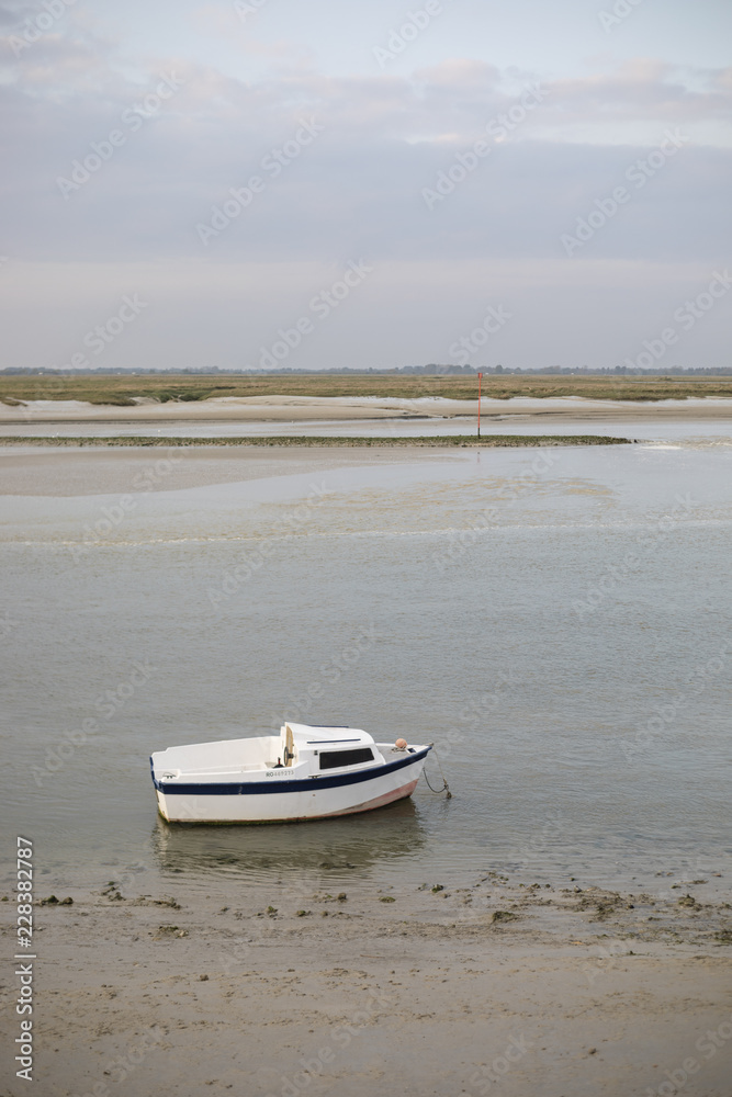 Small boat anchored in Saint Valery sur Somme, France. Small boat anchored in Saint Valery sur Somme, France.