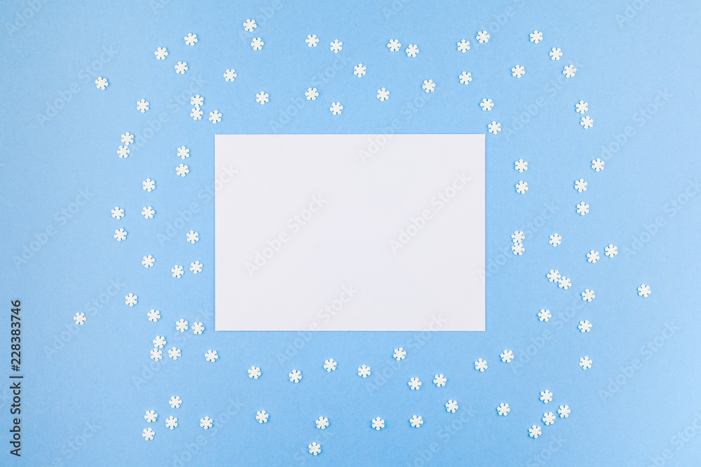Winter pattern made of small white snowflakes Winter pattern made of small white snowflakes