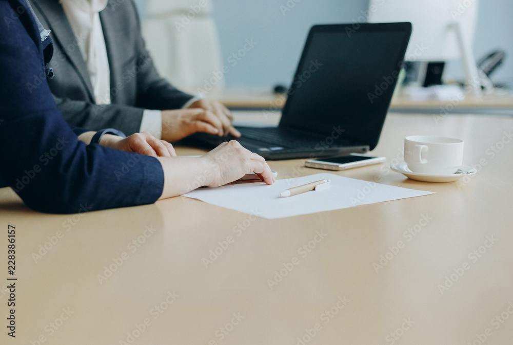 business talks two people office with laptop business talks two people office with laptop