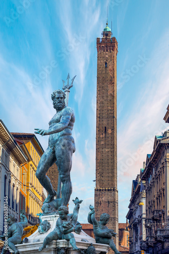 The Neptune Fountain in Piazza del Nettuno - Torre degli Asinelli tower Bologna, Italy photo