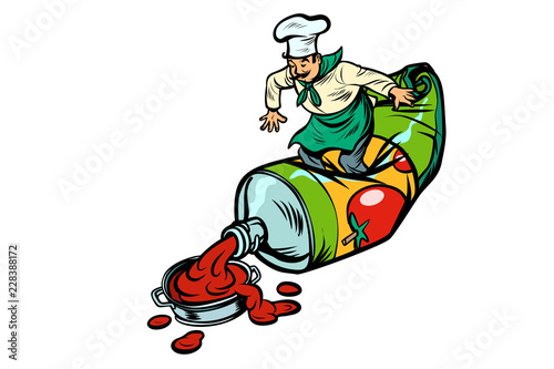 Little chef squeezes ketchup. Cooking food