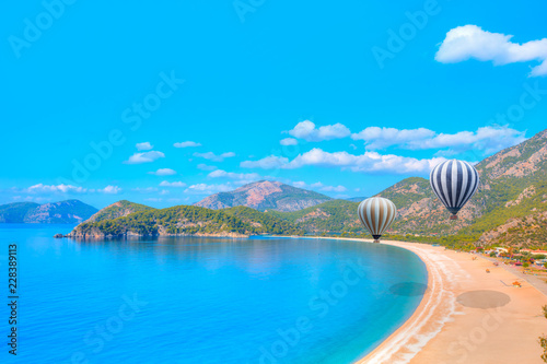 Hot air balloon flying over spectacular oludeniz lagoon
