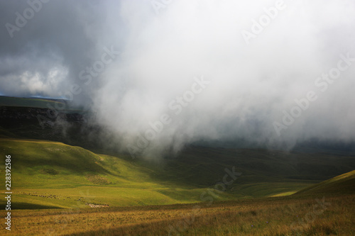 Panoramic view of the clouds above the hills near Mount Elbrus. Photographed in the Caucasus  Russia.