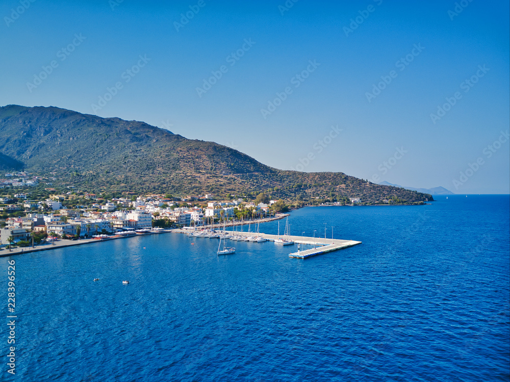 Aerial drone bird's eye view photo of yacht harbor with calm waters, Greece