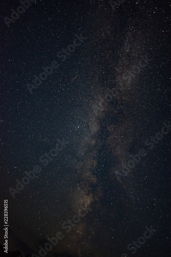 Clouds in the moonlight against the milky way summer night