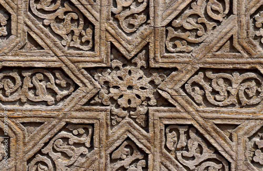 Wooden door floral pattern details of medieval Karakhanid 's tomb in Uzgen,Osh Region, Kyrgyzstan,unesco heritage site