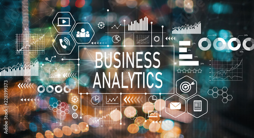 Business analytics with blurred city abstract lights background