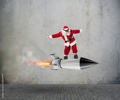 Fotografie Fast delivery of Christmas gifts ready to fly with a rocket