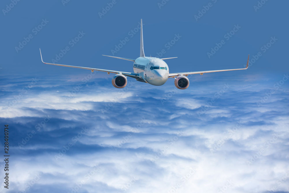 Passenger airplane in the clouds. travel by air transport Passenger airplane in the clouds. travel by air transport