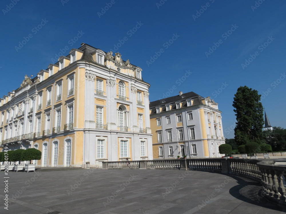 Yellow and white Baroque style palace in Bruhl, Rhineland, Germany, summer
