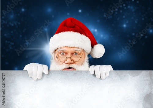 Portrait of Surprised Santa Claus on white