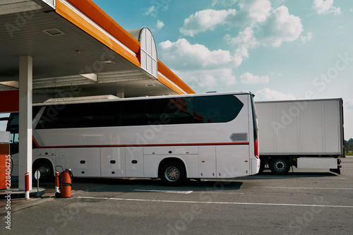 Bus and truck in gasoline station. Service and petrol station