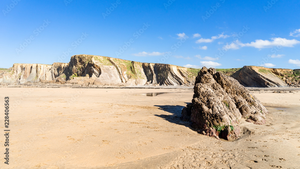 Cornwall Bude Beach with cliffs in the background