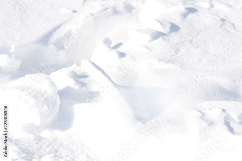 Background. Small clumps of white snow © Natalya Antoshchenko