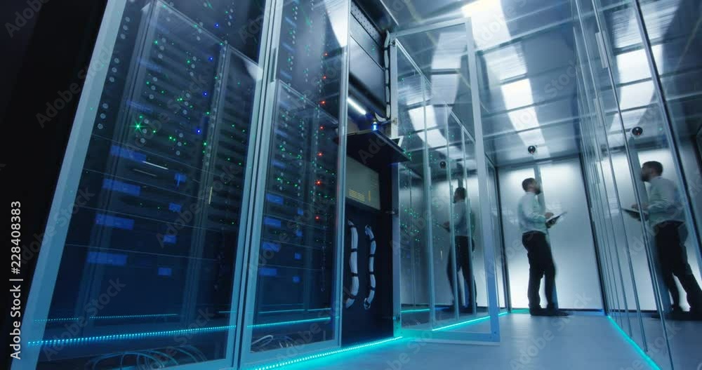 From below view in time lapse of diverse engineers working in data center and leaving room with light going out