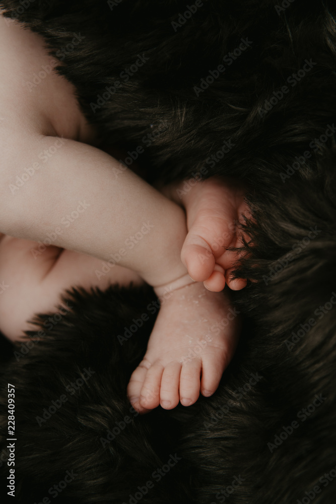 Precious and Beautiful Infant Baby Boy Napping on Brown Fur Blanket in Tiny Wooden Crate Precious and Beautiful Infant Baby Boy Napping on Brown Fur Blanket in Tiny Wooden Crate