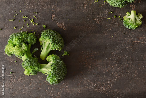 Fresh broccoli on grey background photo