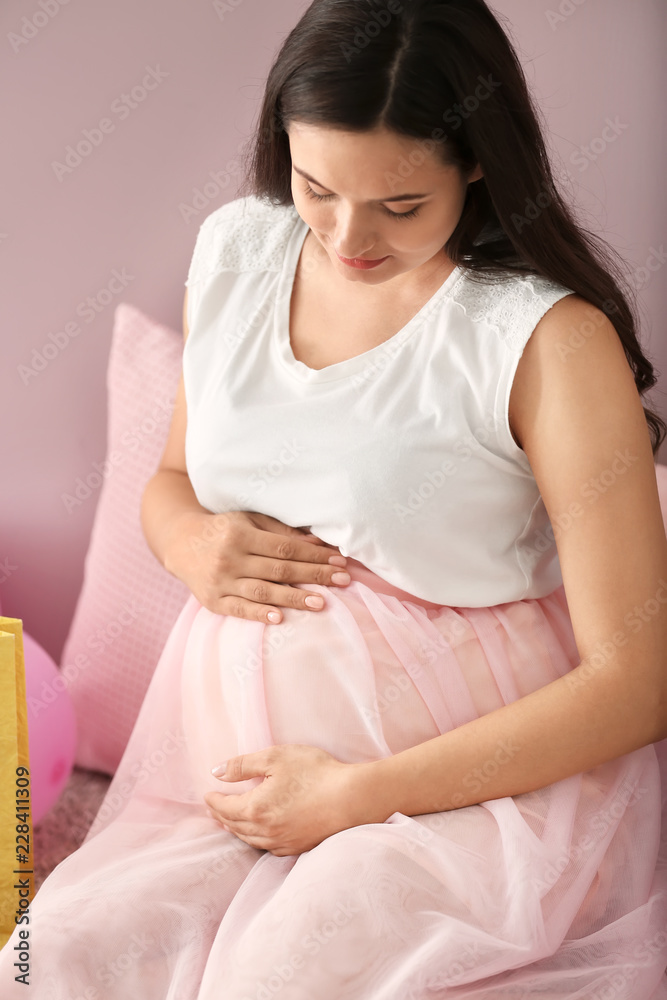 Beautiful pregnant woman at home