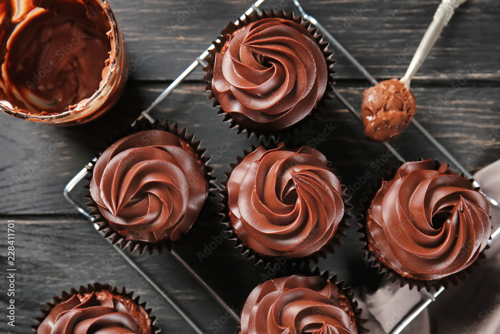 Delicious chocolate cupcakes on cooling rack Delicious chocolate cupcakes on cooling rack