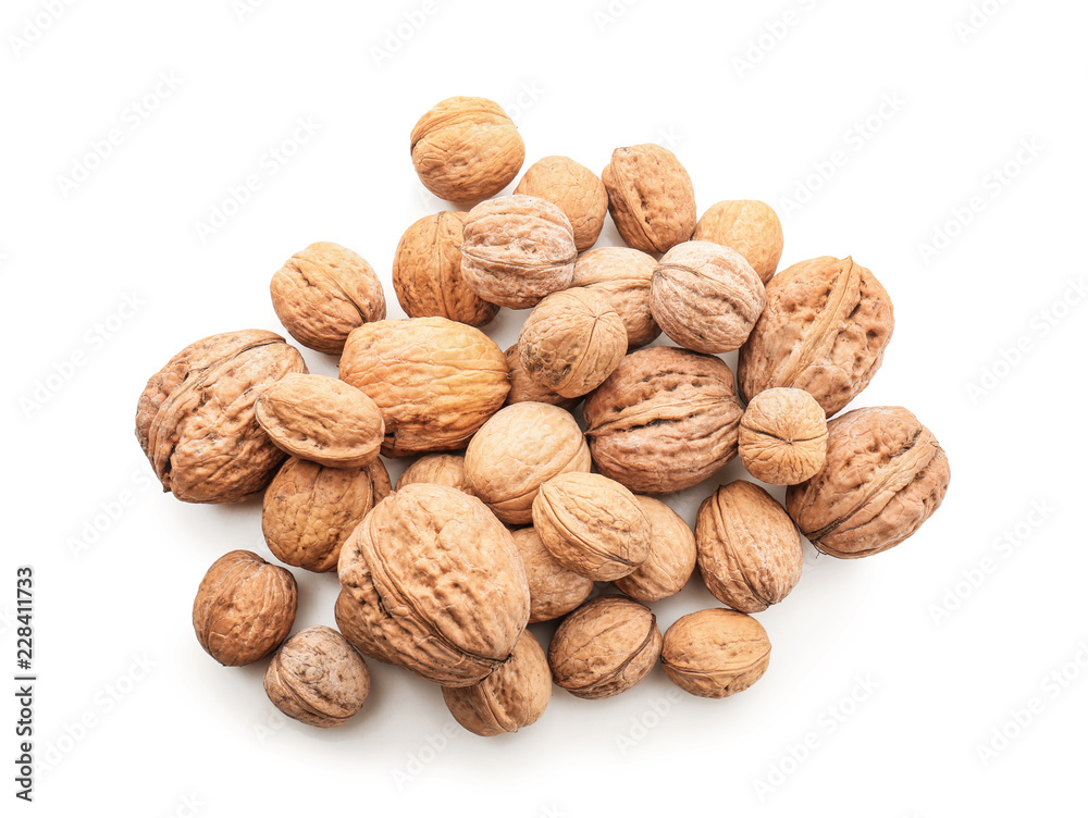 Unpeeled walnuts on white background Unpeeled walnuts on white background