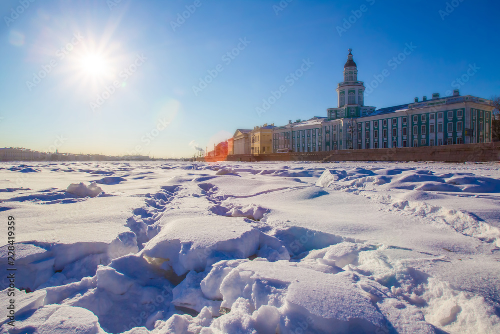 Saint Petersburg. Winter. Neva River. Museum of the Kunstkamera in St. Petersburg. Neva River in the ice. Sunny day in winter. Russia. Architecture of Petersburg.