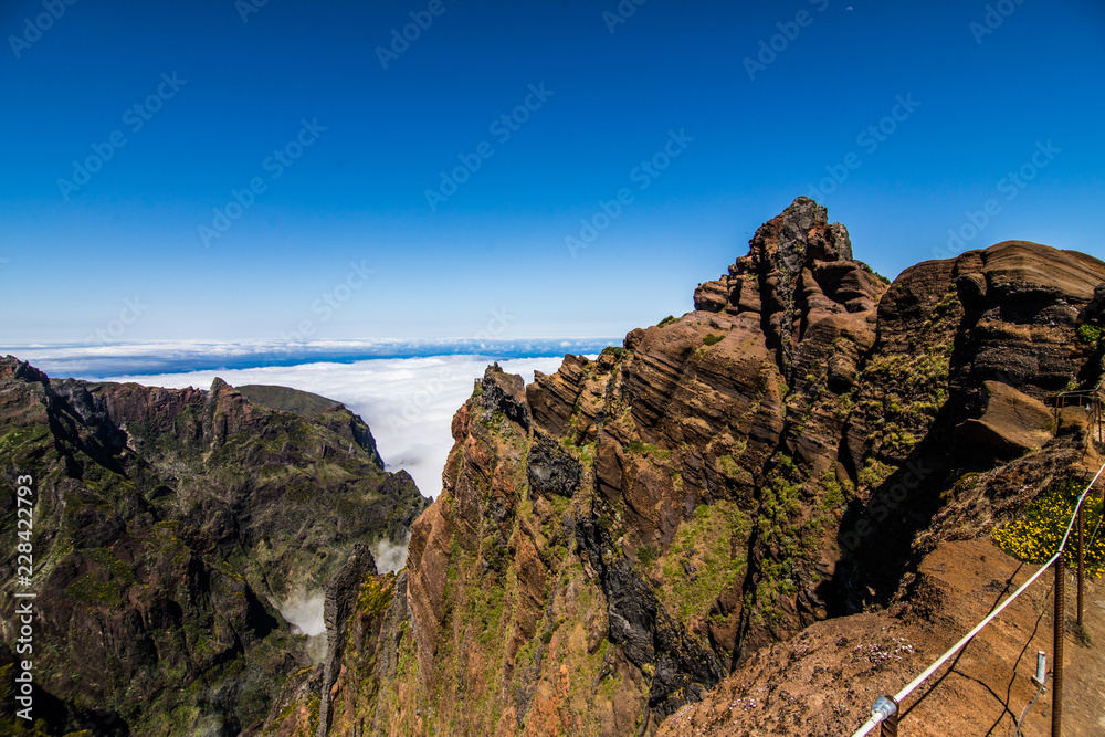 Trekking from Pico do Arieiro to Pico Ruivo, Madeira island, Portugal. Road to clouds.