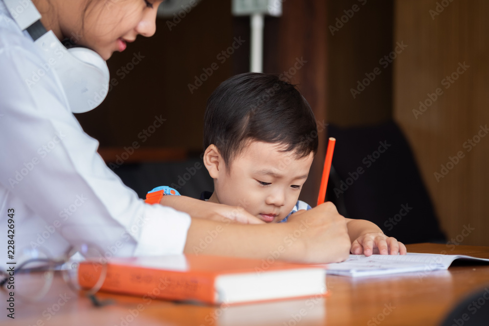cute girl smiled and sitdown to drawing a book in the library, children concept, education concept cute girl smiled and sitdown to drawing a book in the library, children concept, education concept