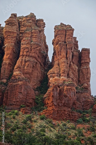 Sedona, Arizona, USA: Red sandstone formations shine with brilliant color after a summer rain storm in the Coconino National Forest.