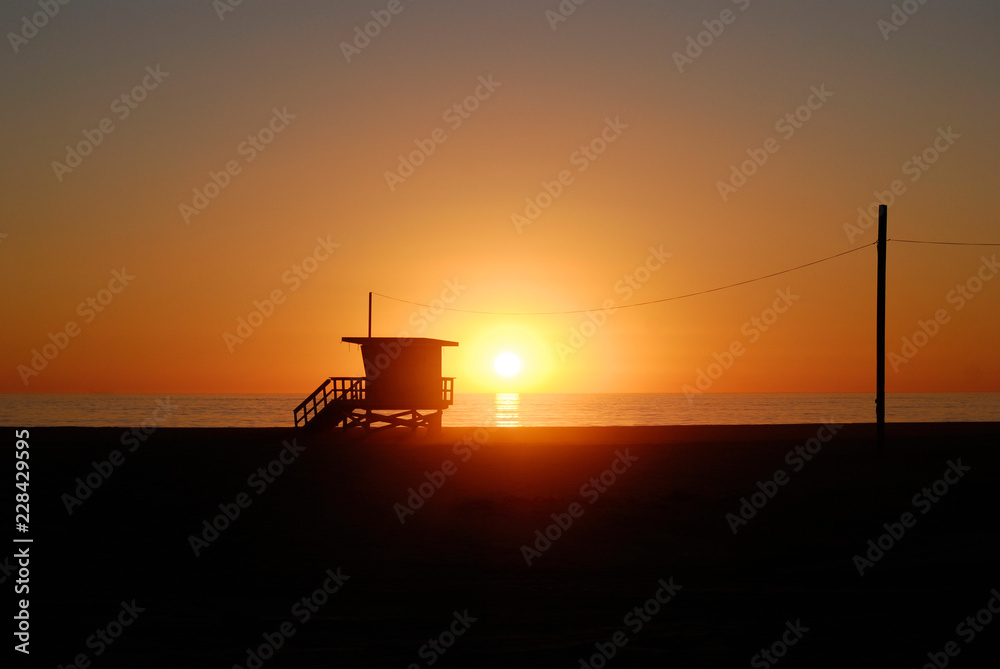 Lifeguard tower station at sunset