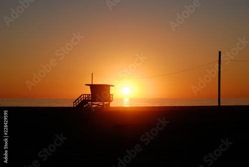 Lifeguard tower station at sunset