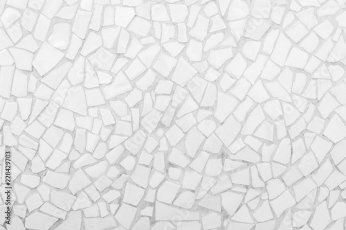 Broken tiles mosaic seamless pattern. White and Grey the tile wall high resolution real photo or brick seamless and texture interior background. © Phokin