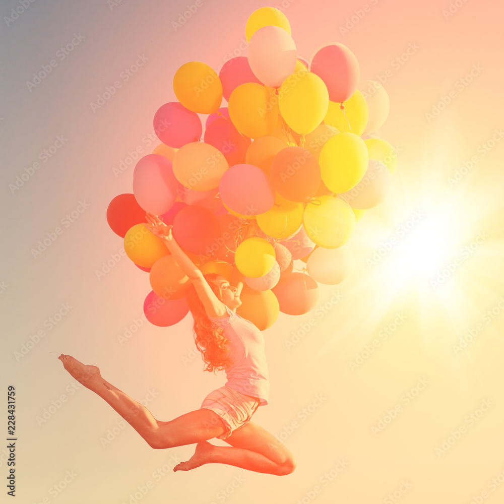 Girls with balloons at sunset. Stylish young women models against the