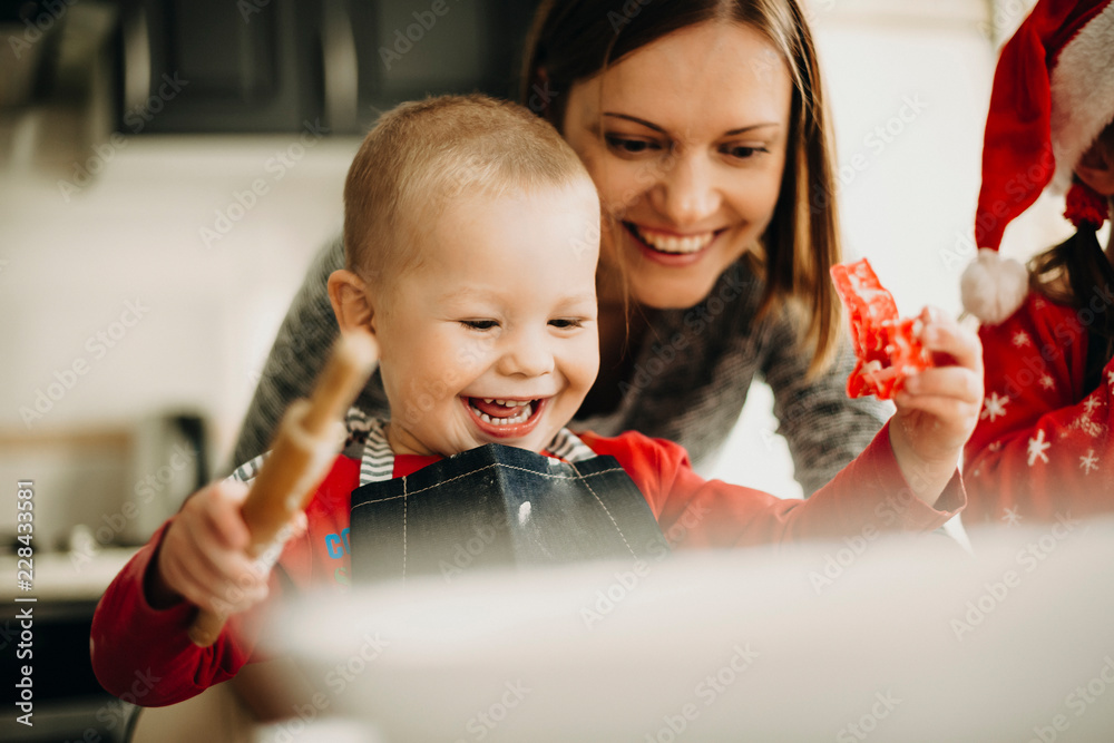 Woman with kids making cookies for holiday Woman with kids making cookies for holiday