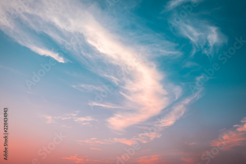 Sunset sky with curve cloud in blue and yellow color © korkeng