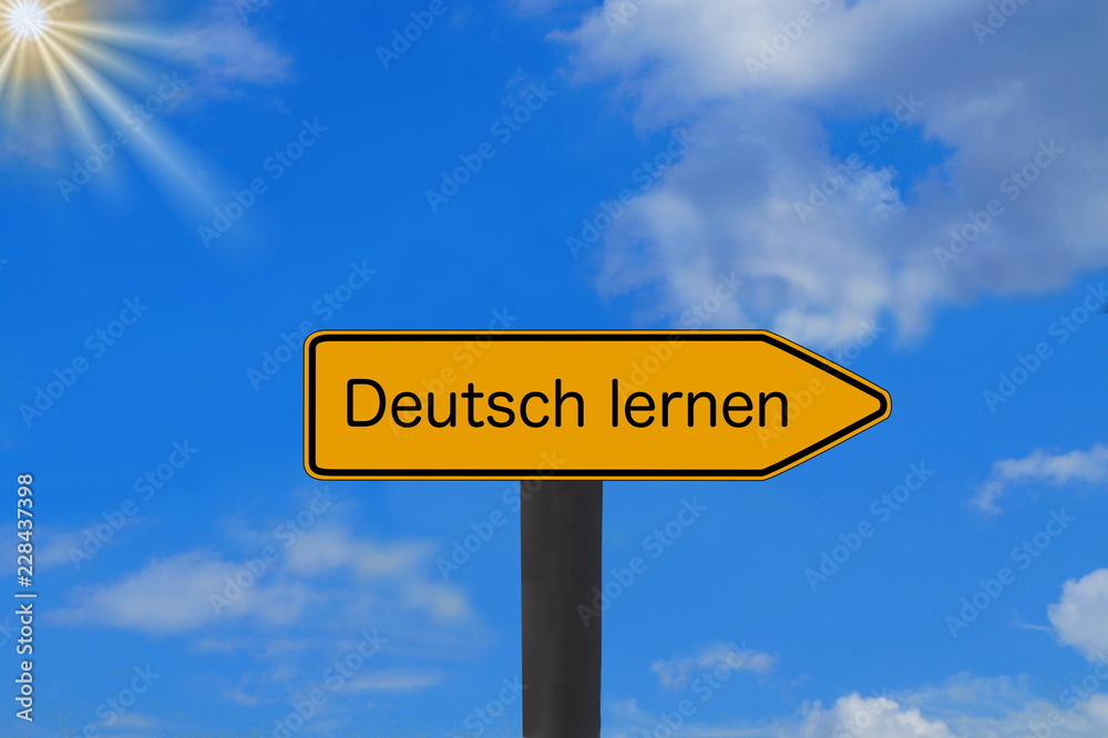 Ein Schild mit dem Aufdruck Deutsch Lernen Ein Schild mit dem Aufdruck Deutsch Lernen