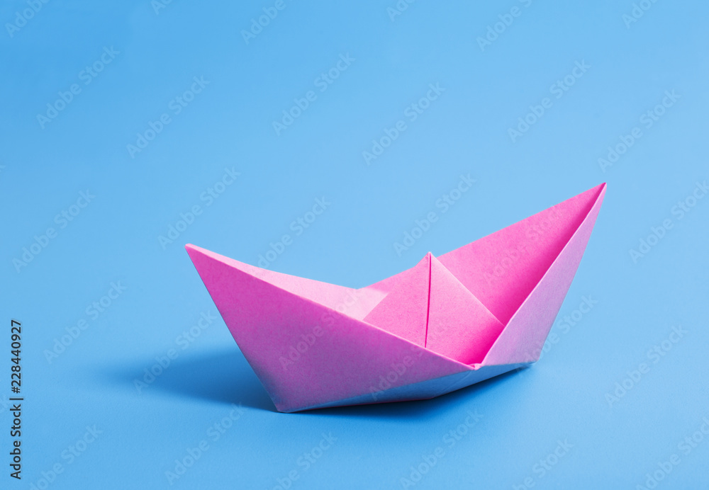 paper boat on blue paper background paper boat on blue paper background