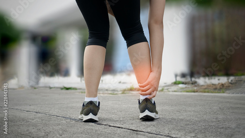 Female Runner  leg and muscle pain © rainyrf