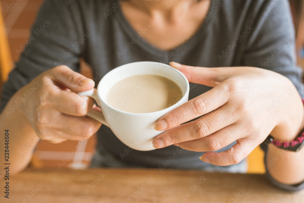 woman hold a cup a coffee woman hold a cup a coffee